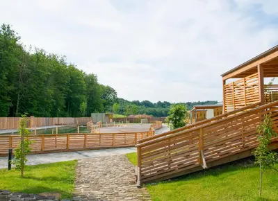 a wooden fence in front of a tennis court at Glamping SUN VALLEY Bioterme in Mala Nedelja