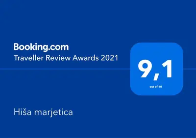 a blue box with the text traveler review awards at Hiša marjetica in Maribor