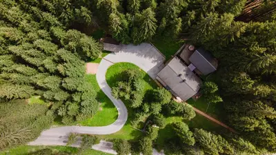 an aerial view of a house in the middle of a forest at Vila Triglav on Pokljuka in Goreljek