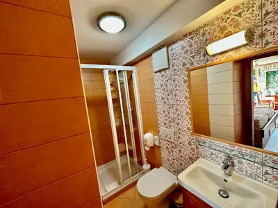 a bathroom with a toilet and a sink at B&B Villa Angelina in Rogaška Slatina
