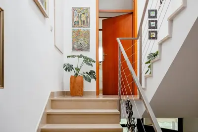 a staircase in a house with a potted plant at Green Point in Preserje
