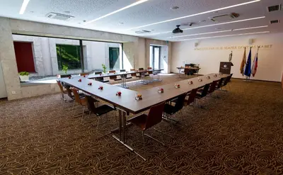 a large conference room with a long table and chairs at Rimske Terme Resort - Hotel Zdraviliški dvor in Rimske Toplice