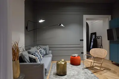 a living room with a couch and a table at Apartments Rog in Ljubljana