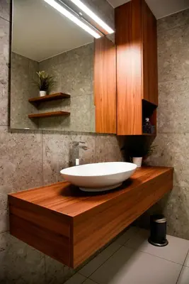 a bathroom with a white sink on a wooden counter at Apartments Villa Popp in Ljubljana