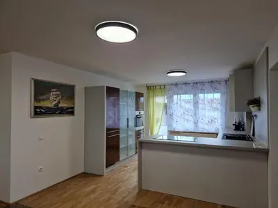 a kitchen with a counter top and a window at Patricia House in Ljubljana