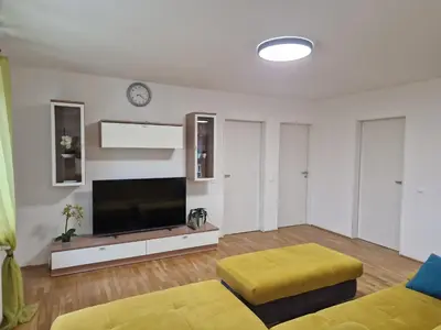 a living room with a large flat screen tv at Patricia House in Ljubljana