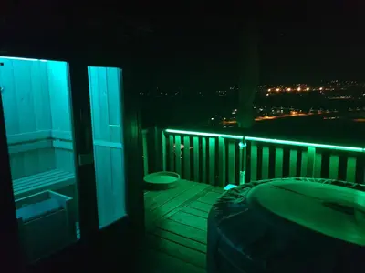 a balcony with a bath tub and a bath tub at Gnezdo Vid-ik in Čatež ob Savi