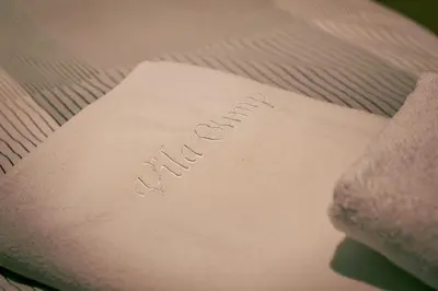 a piece of paper with the word mail on a bed at Apartments in Villa Olimp in Ljubljana