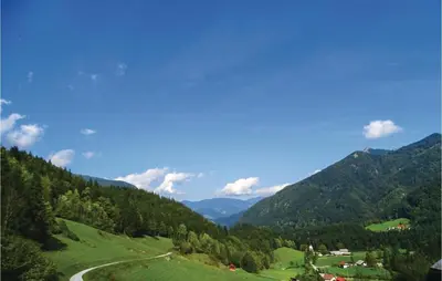 a view of a valley with mountains and a road at 2 Bedroom Stunning Home In Luce in Luče