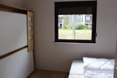 a room with a window and a bed in it at ApBovec in Bovec