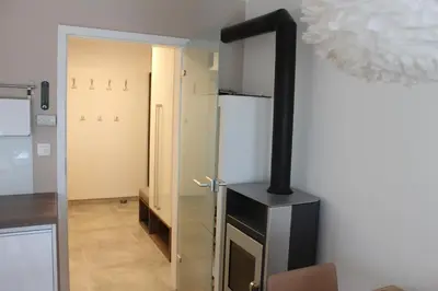 a stove in a room with a refrigerator at ApBovec in Bovec
