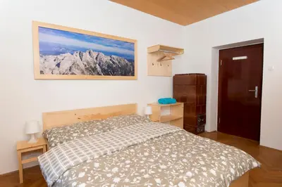 a bedroom with a bed and a picture on the wall at Vila Lipa in Bled