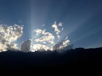 a group of clouds in the sky over mountains at Apartma Miko in Bovec