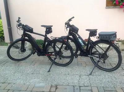 two bikes are parked next to a building at Počitniška hiša Pri Kuštrču in Grahovo