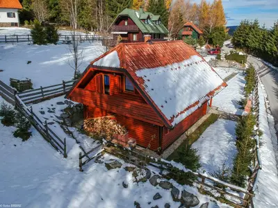 an aerial view of a house in the snow at Koča na Planini in Planina pod Sumnikom