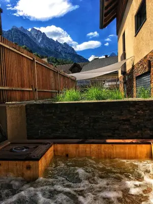 a hot tub in the backyard of a house at House Neza in Kranjska Gora
