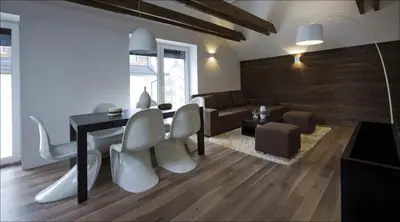 a living room with a table and chairs and a couch at House Neza in Kranjska Gora