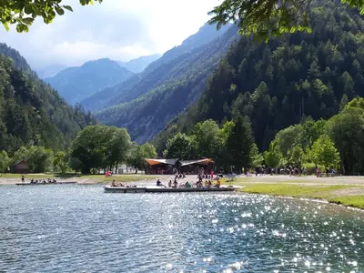 a group of people on a boat on a river at Hotel Vandot in Kranjska Gora