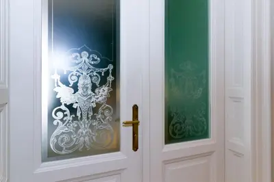 a white door with a sticker on it at Filip’s Palace Luxurious Apartment in Ljubljana
