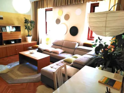 a living room with a couch and a table at Apartments Banko in Bled