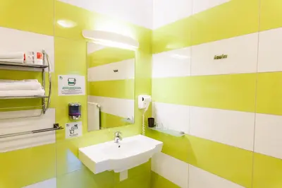a bathroom with a sink and a mirror at Dvorec Trebnik - SOBE in Slovenske Konjice