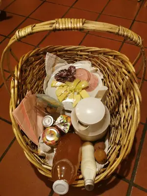 a basket with food in it on a floor at Bled Paradise Apartments in Bled