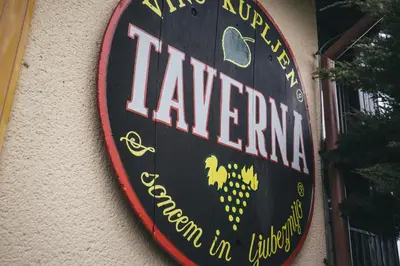 a sign for a restaurant on the side of a building at Taverna & Wine Jeruzalem in Ivanjkovci