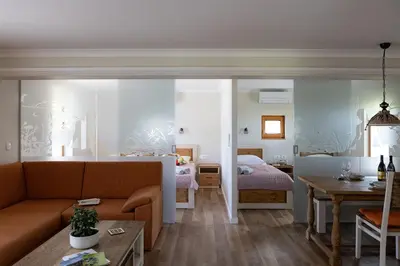 a living room with a bed and a couch at Holiday Home Virida, app Leopold III in Ivančna Gorica