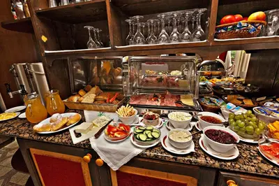 a buffet with many different types of food on a table at PRIVILLAGE Stare - B&B in Bohinj