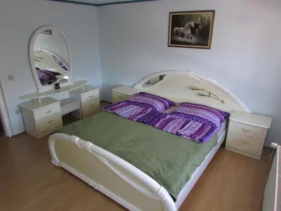 a bedroom with a white bed and a mirror at TURISTIČNA KMETIJA LIPNIK in Lovrenc na Pohorju