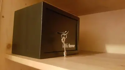 a key sitting on a shelf next to a television at Apartma Lenka Kranjska Gora in Kranjska Gora