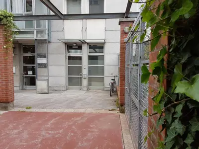 an entrance to a building with a bike parked outside at Metelkova in Ljubljana