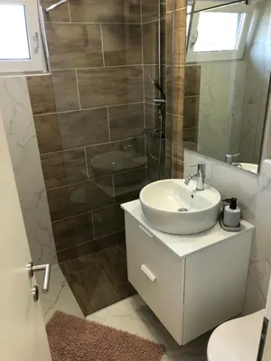 a bathroom with a sink and a shower at Bovec Apartment in Bovec