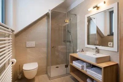 a bathroom with a sink and a shower at Apartments Sivka - Private Sauna in Cerklje na Gorenjskem