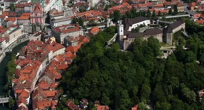 an aerial view of a city with red roofs at Apartments Sivka - Private Sauna in Cerklje na Gorenjskem