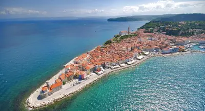 an aerial view of a small island in the water at Apartments Sivka - Private Sauna in Cerklje na Gorenjskem