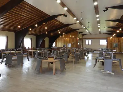 a large room with chairs and tables in it at Ranch Marina in Koče