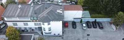 an aerial view of a house with cars in a parking lot at Apartma City & Free Parking in Ljubljana
