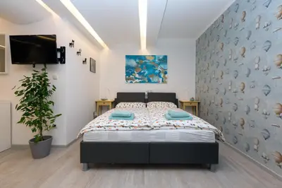 a bedroom with a large bed in a room at Big yard in Ljubljana