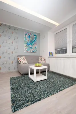 a living room with a couch and a table at Big yard in Ljubljana