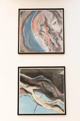 a pair of framed paintings on a wall at Big yard in Ljubljana