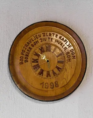a clock on a wall with a clock on it at Apartma PEPI in Rogaška Slatina