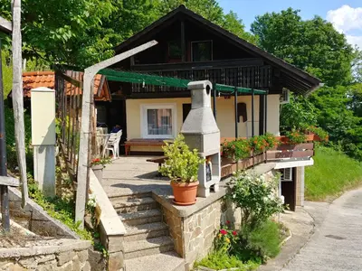a house with a bell in front of it at Apartma PEPI in Rogaška Slatina