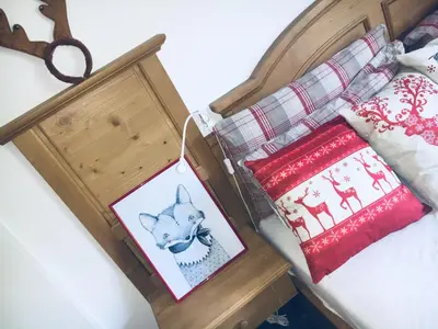 a wooden box with two christmas cards in it at Vall’s apartment- by ski slopes in Kranjska Gora