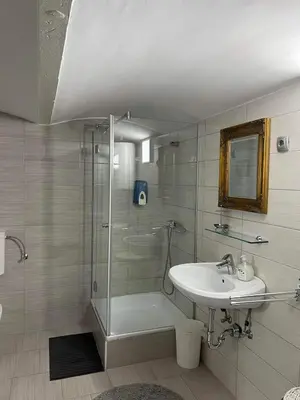 a bathroom with a shower and a sink at apartma 