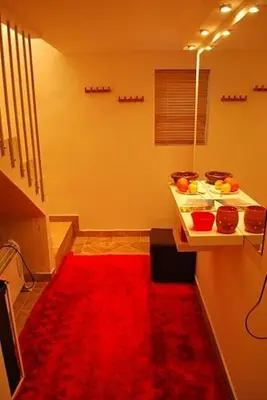 a room with a red carpet and a red rug at Apartments Lavric in Nova Vas