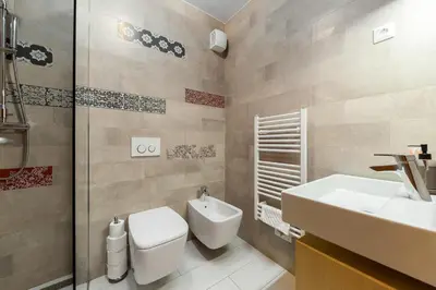 a bathroom with a toilet and a sink at Mountain Charm in Kranjska Gora