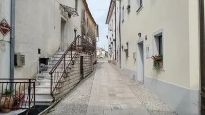an empty alley with stairs in an old building at Apartma in soba Vipavski Križ in Ajdovščina