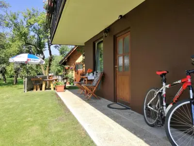 a bike parked on the side of a house at Apartma Andrej in Rateče