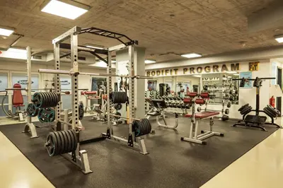 a gym with lots of equipment in a room at Hotel City Maribor in Maribor